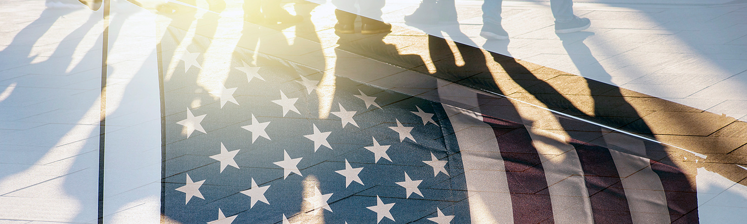 American Flag Overlaid on Feet on the Ground