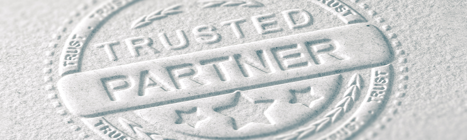 Letterpressed Stamp Reading 'Trusted Partner'