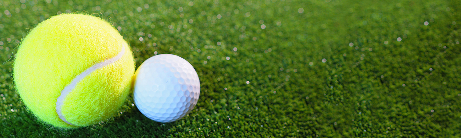 Close Up of Tennis Ball and Golf Ball on Green Grass